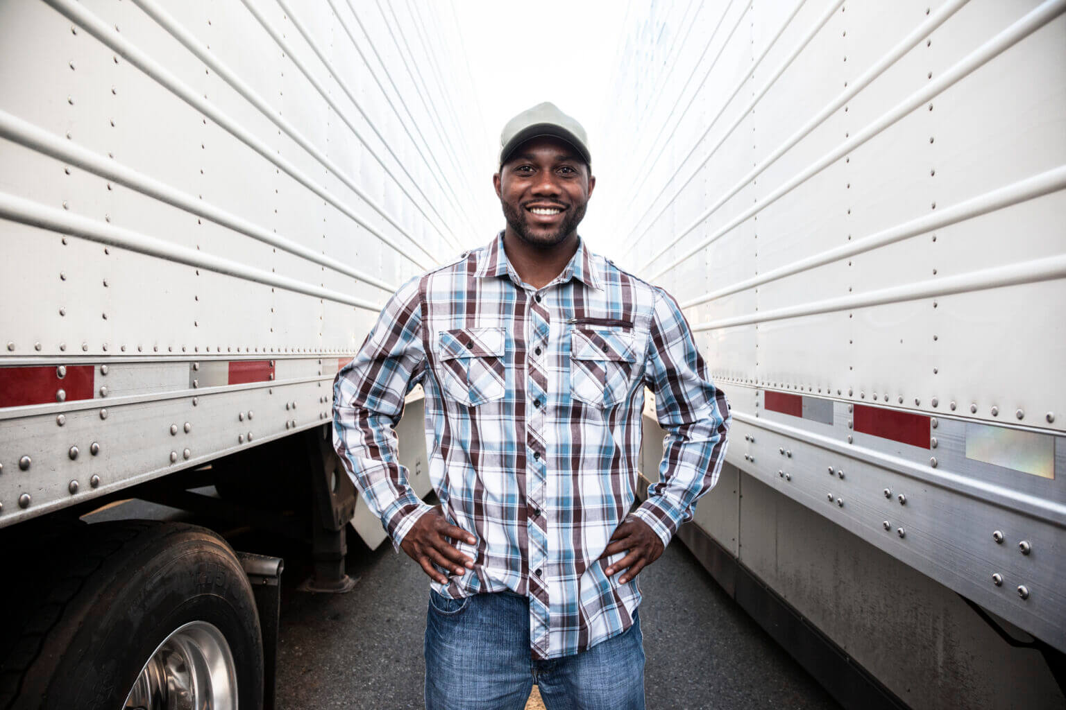 trucker-standing-by-his-large-truck-2025-04-03-01-04-41-utc-1536x1024 (1)